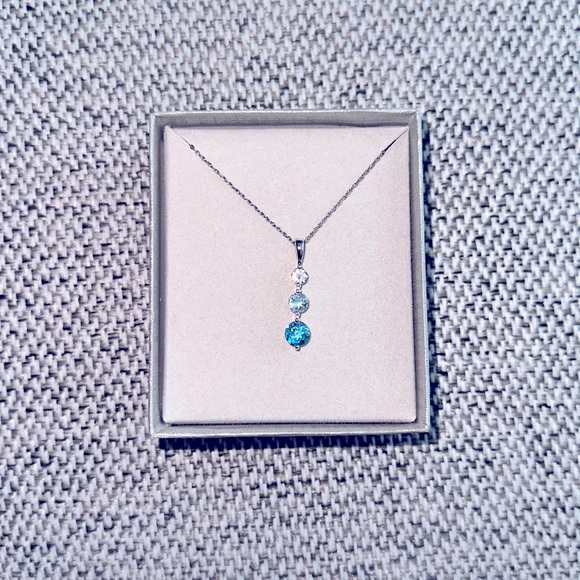 Zales Jewelry - Blue and White Topaz Three Stone Pendant in Sterling Silver